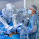 Cardiologist interacting with a holographic 3D heart model using augmented reality technology in a modern cardiac catheterization laboratory
