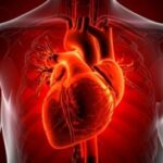 Person experiencing chest burning sensation while wondering if it is acidity or a heart problem