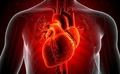 Person experiencing chest burning sensation while wondering if it is acidity or a heart problem