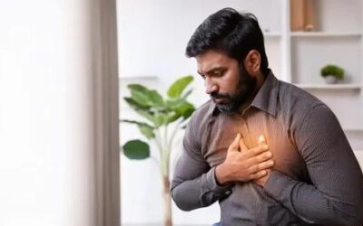 Corporate professional practicing breathing exercises to stimulate the vagus nerve and improve heart health