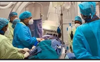 Cardiologist performing TAVI procedure for a senior patient with aortic stenosis using minimally invasive valve replacement technology.