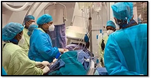 Cardiologist performing TAVI procedure for a senior patient with aortic stenosis using minimally invasive valve replacement technology.