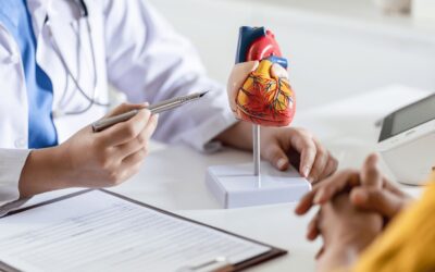 Cardiologist reviewing AI-powered IVUS and OCT imaging to determine whether a patient needs a heart stent or bypass surgery.
